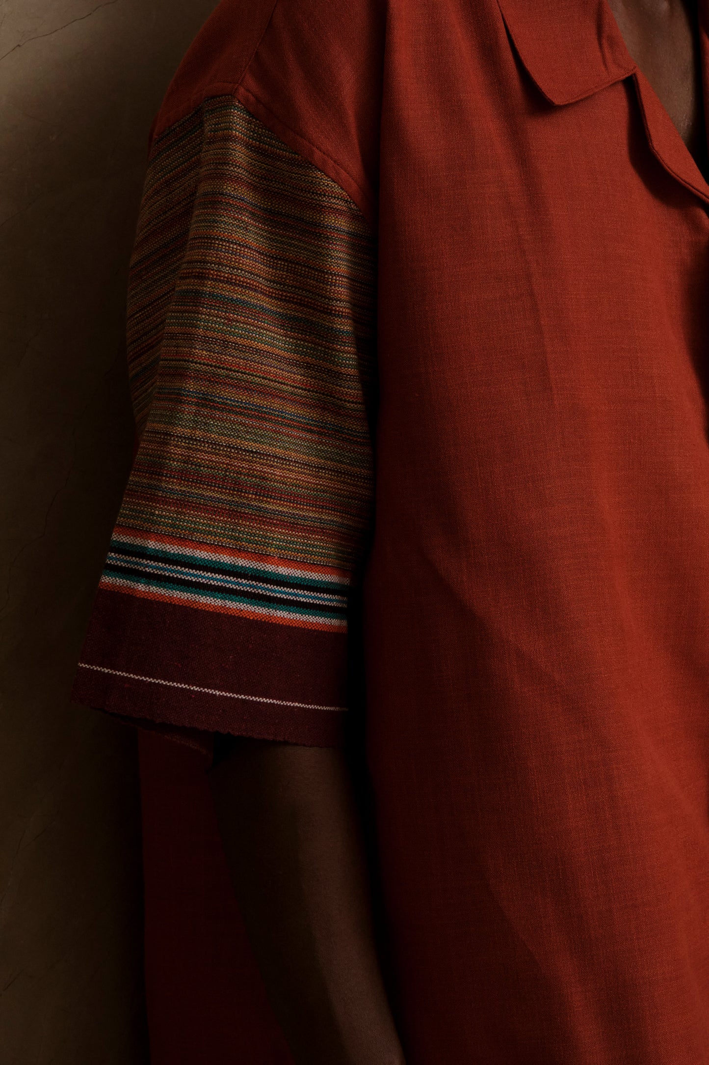 Detailed close up of Rock 2.0 showing textured canvas fabric, handcrafted stitching, heritage textile references, and artisanal wearable textile detailing
