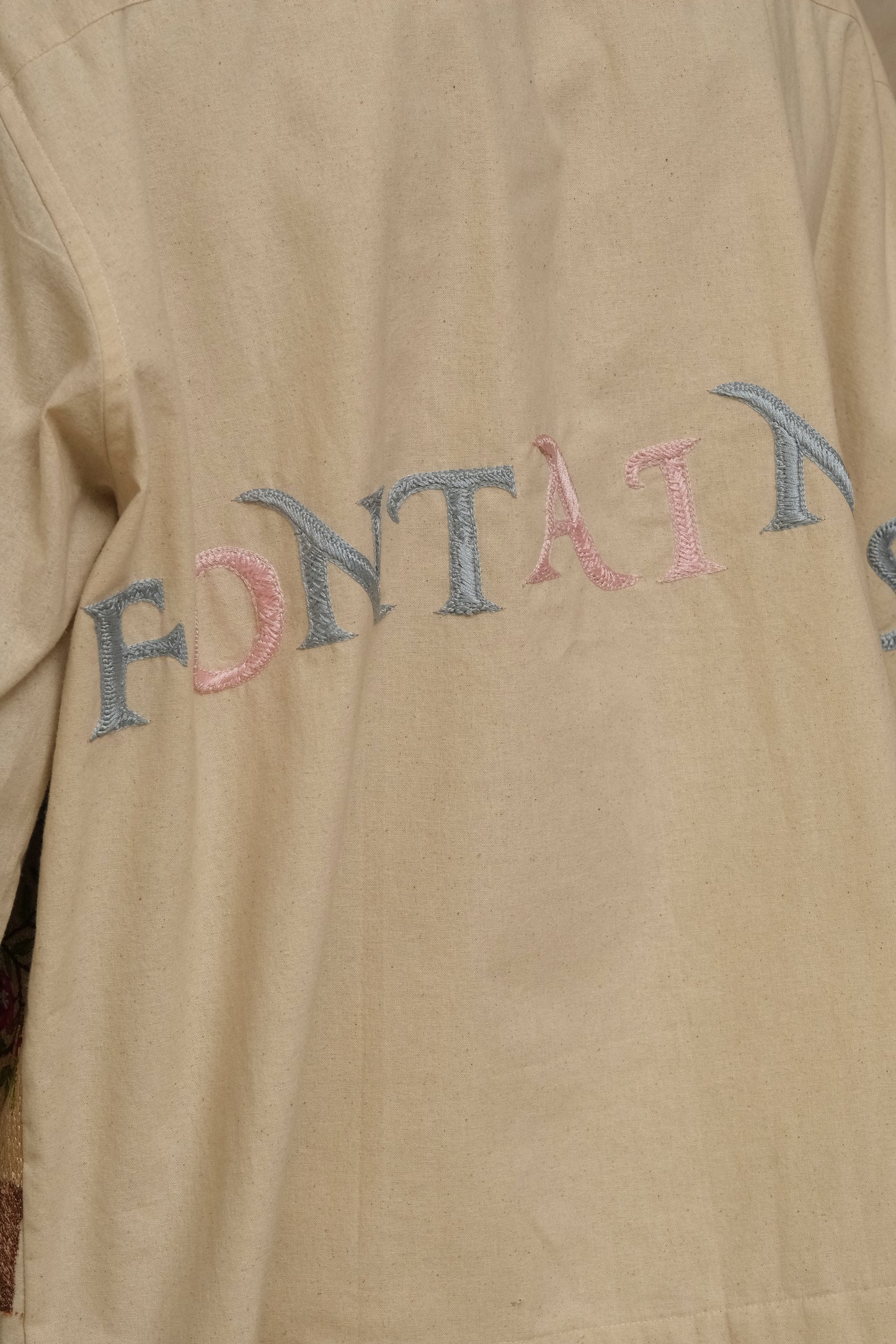 hand-embroidered shirt, wearable art in unbleached cotton. Documentary style hand embroidery.  Silver Buttons. Latin Quarters. Archival Clothing. Image to Textile. Mix Media.
