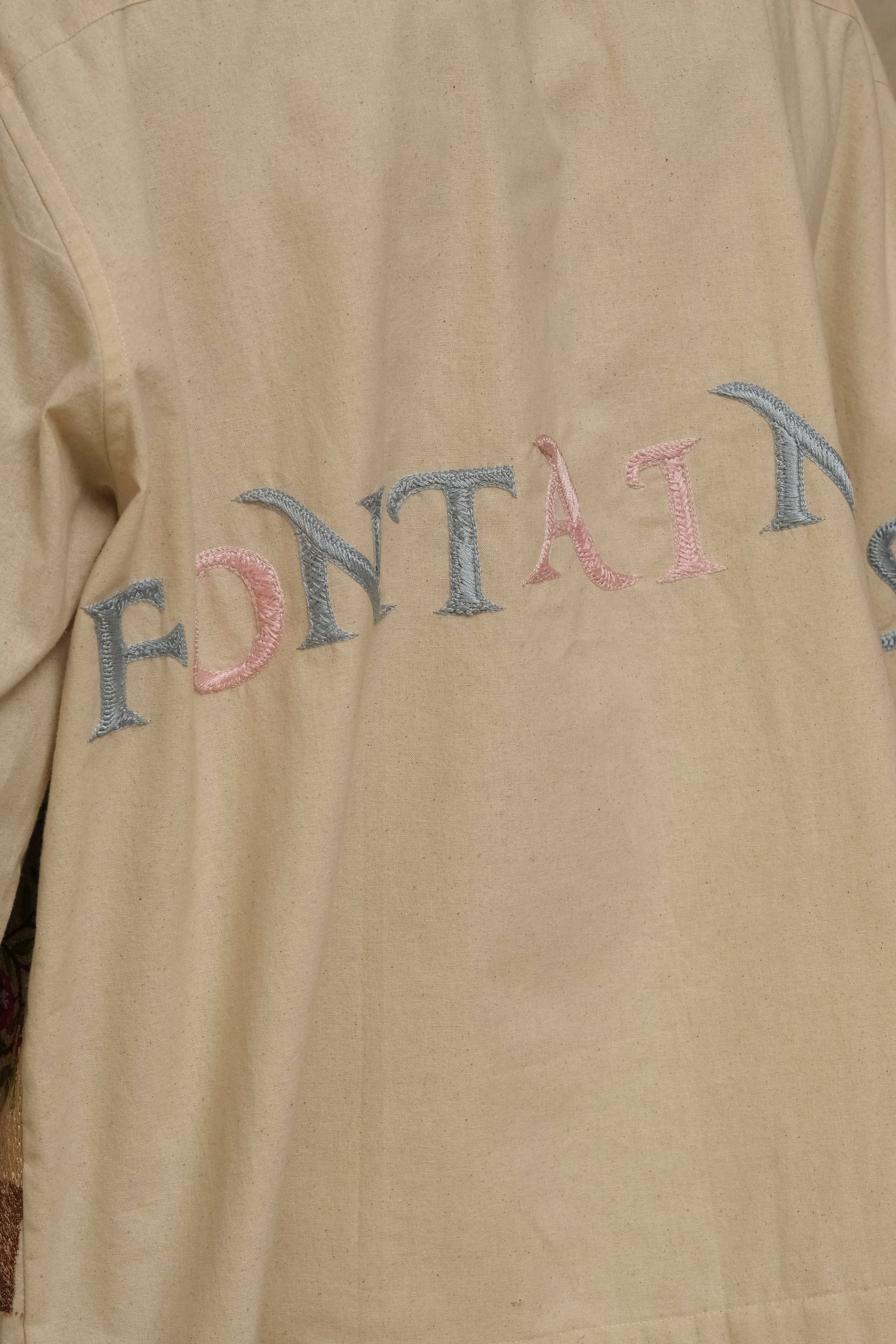 hand-embroidered shirt, wearable art in unbleached cotton. Documentary style hand embroidery.  Silver Buttons. Latin Quarters. Archival Clothing. Image to Textile. Mix Media.