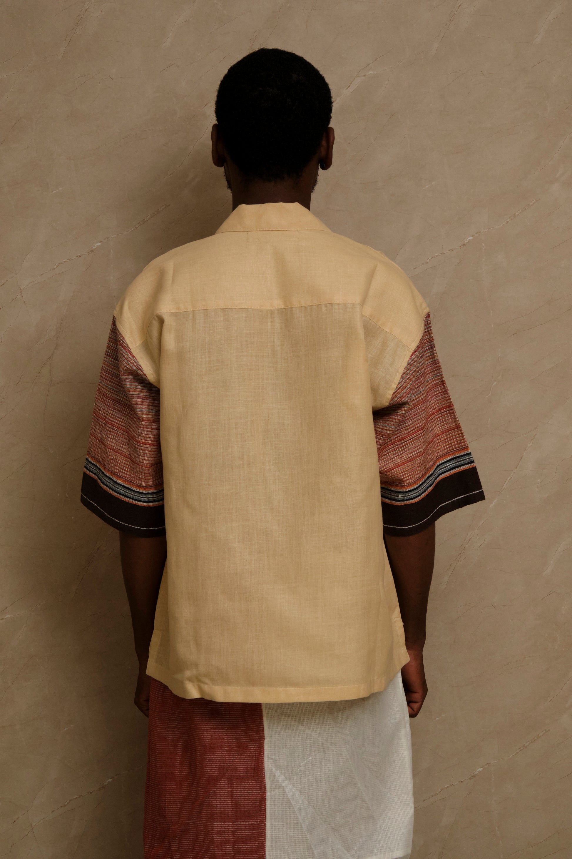 Rock 1.0 one of one handcrafted artwear shirt featuring cotton linen canvas construction, vintage textile panels, pearl buttons, and slow crafted collector focused detailing. back view