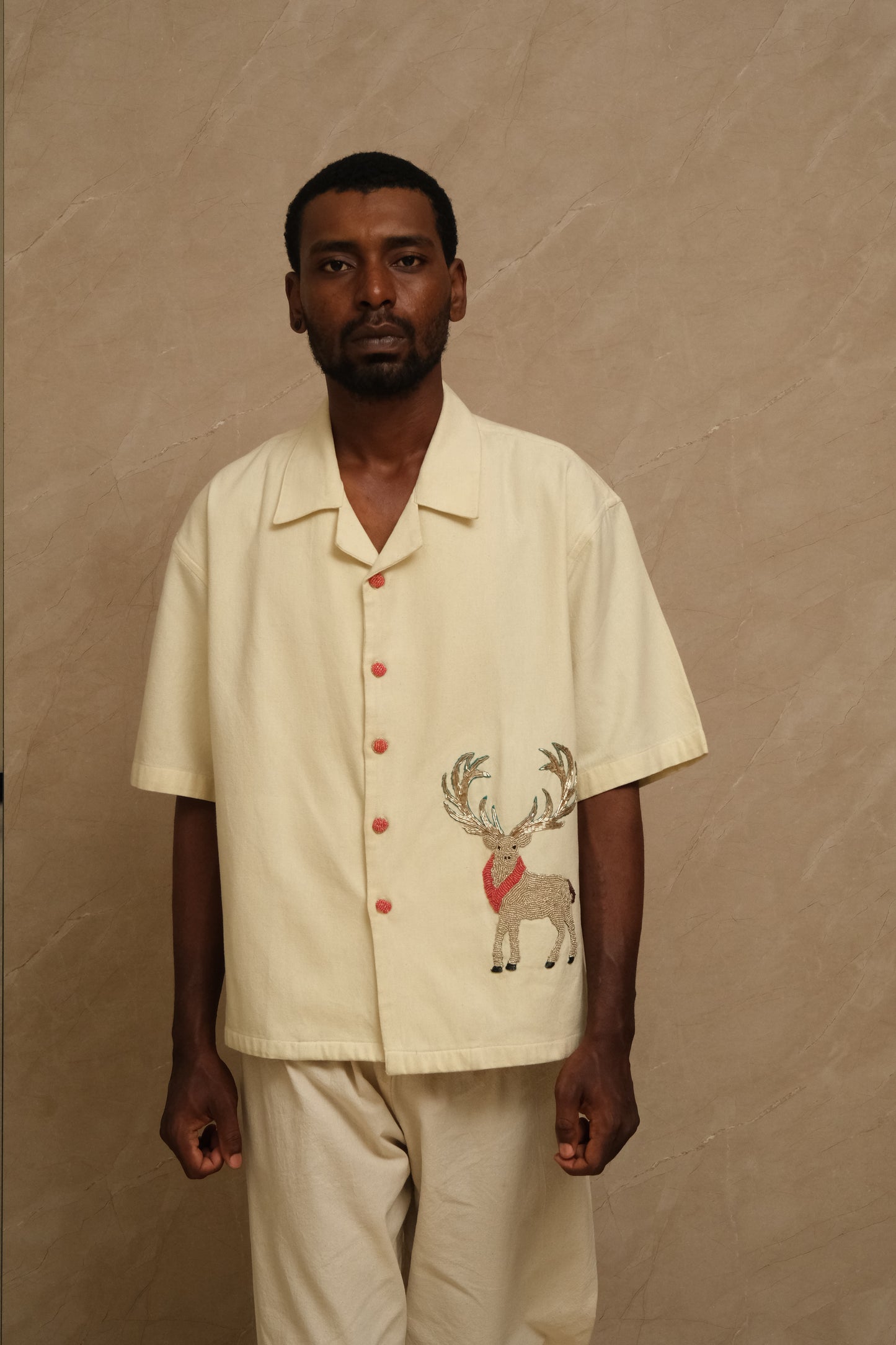 Front view of the Barasingha hand embroidered shirt featuring detailed threadwork, textured cotton structure, and handcrafted wearable textile storytelling