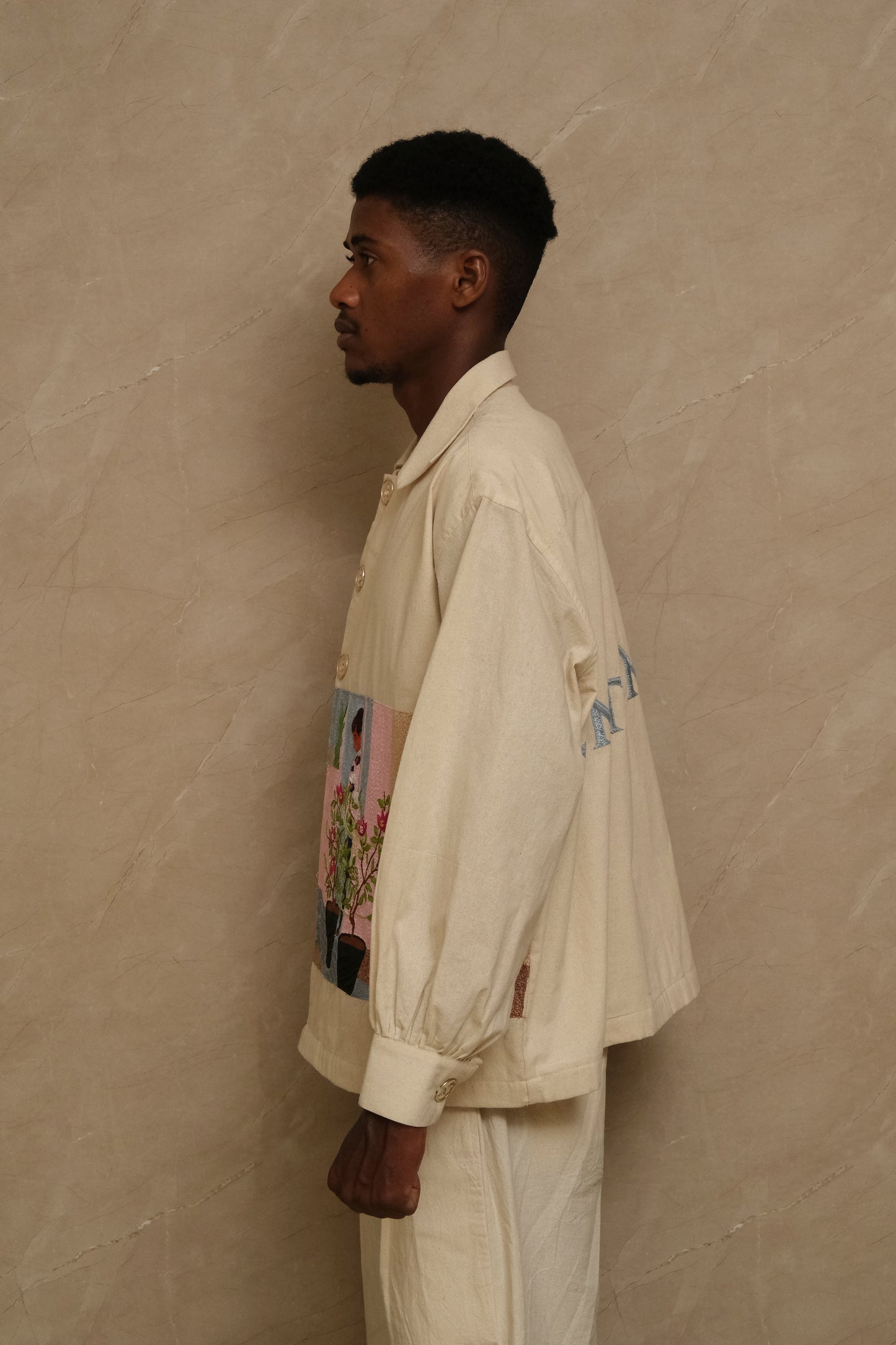 Fontainhas wearable textile artwork with intricate hand embroidery, natural fabric texture, collector level detailing, and heritage inspired ornamentation designed as a one of one archival piece