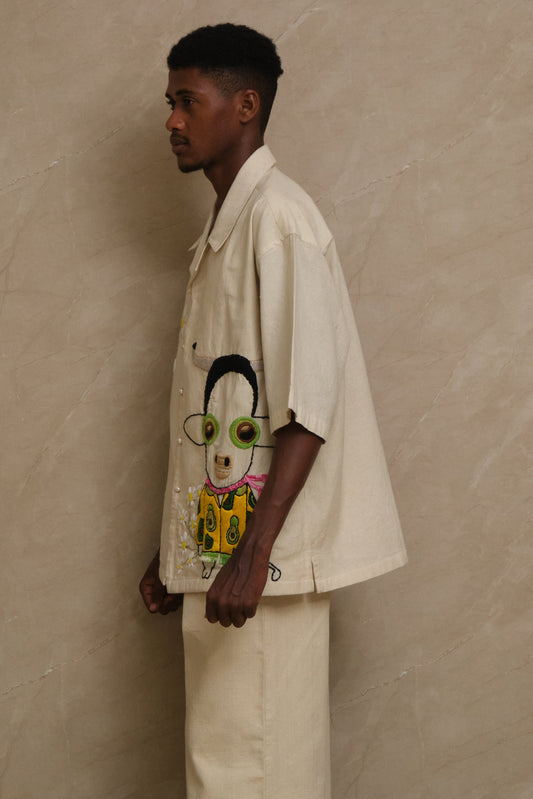 Gudda embroidered textile artwork photographed in natural tones highlighting handcrafted surface detailing, slow stitched embroidery, and one of one artwear composition