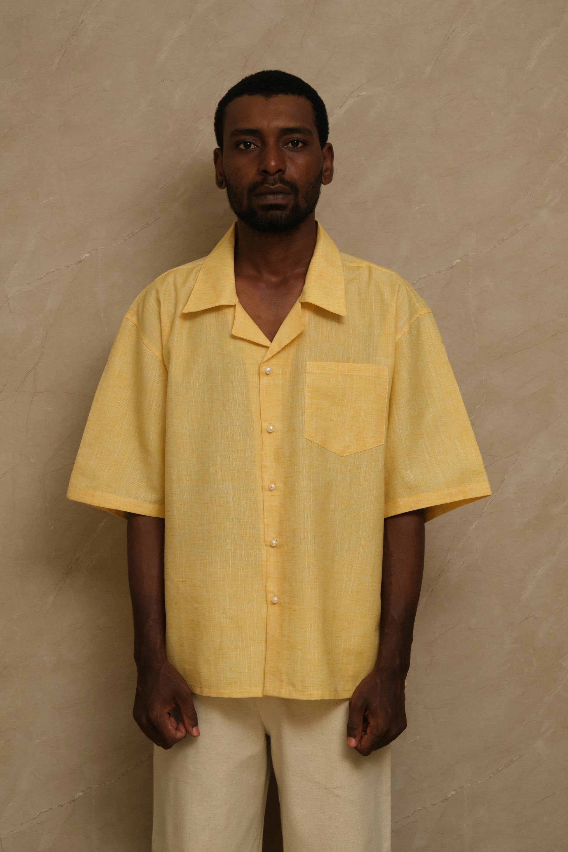 Mango one of one linen artwear shirt featuring natural pearl buttons, handcrafted textile construction, and slow crafted collector focused wearable artwork
