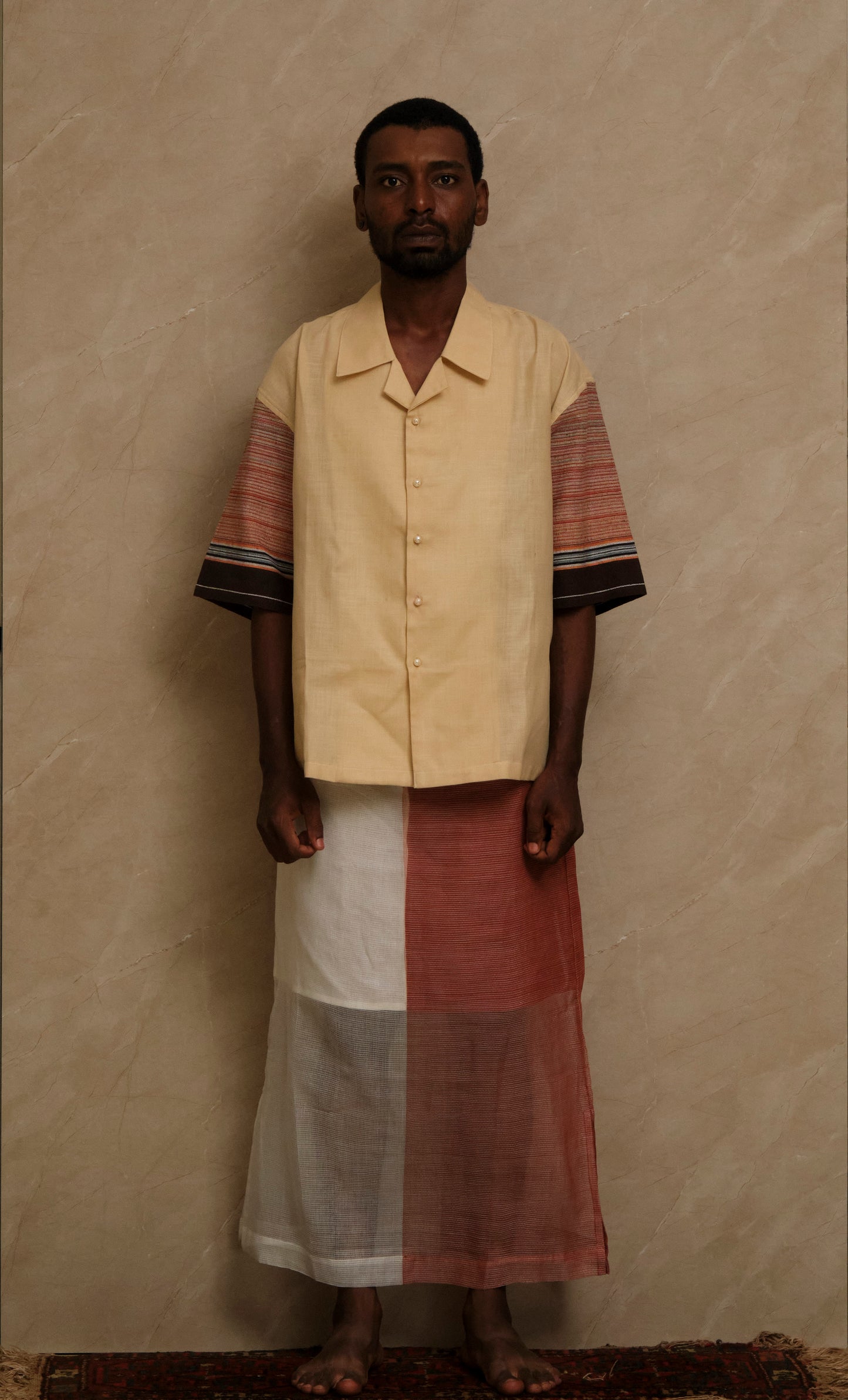 Rock 1.0 textile artwork photographed in natural editorial tones highlighting handcrafted fabric composition, artisanal detailing, and slow crafted wearable art construction