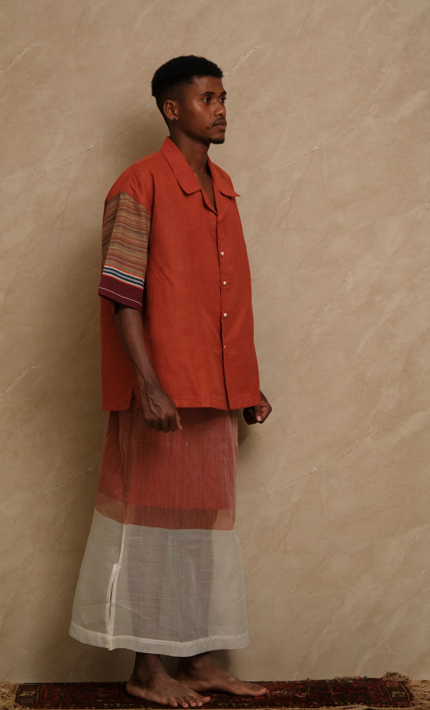 Front view of the Rock 2.0 handcrafted shirt featuring cotton linen textures, vintage textile panels, pearl buttons, and collector focused artwear craftsmanship