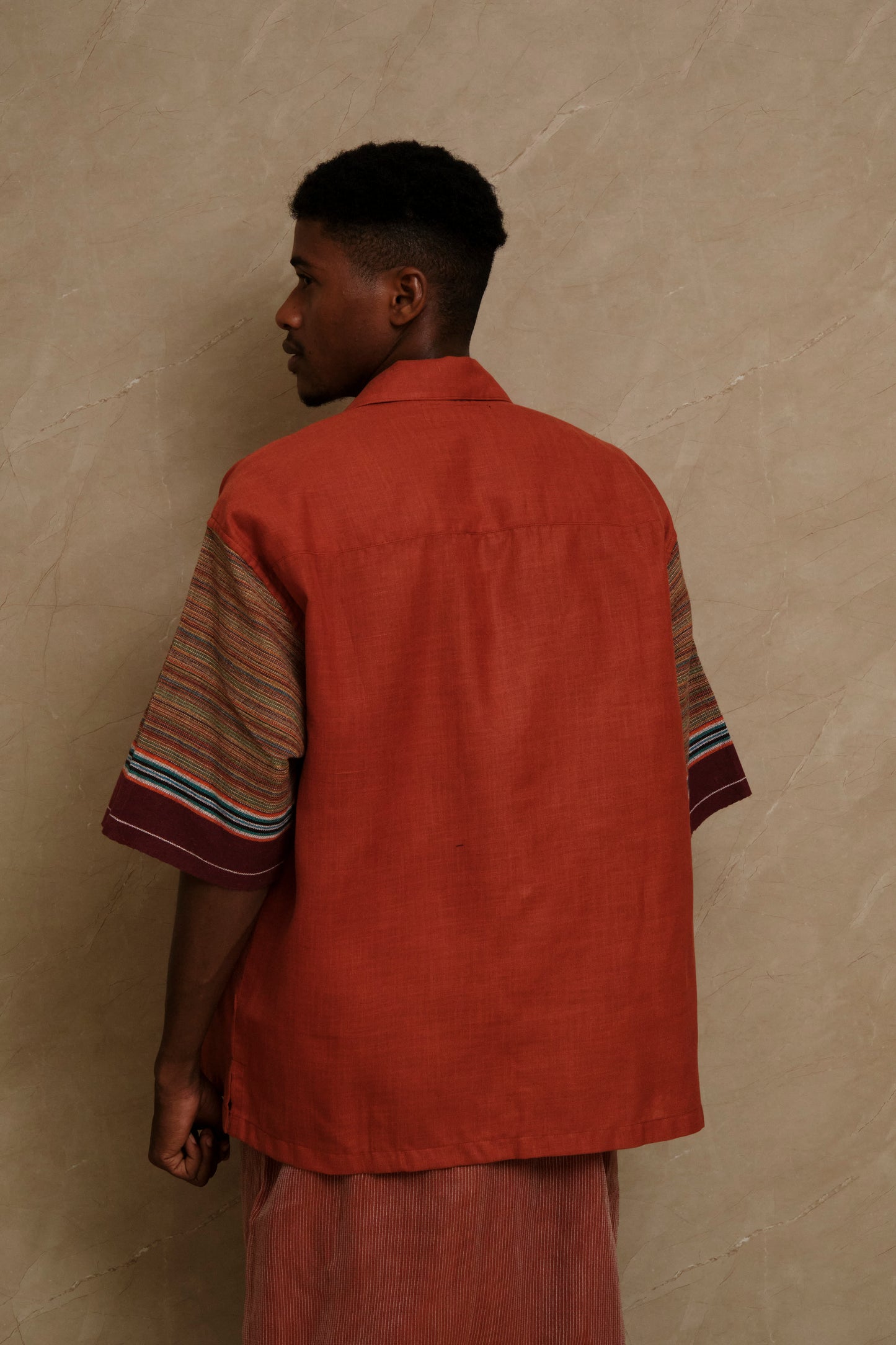 Rock 2.0 textile artwork photographed in soft natural editorial tones highlighting handcrafted textile composition, artisanal detailing, and slow crafted wearable art construction