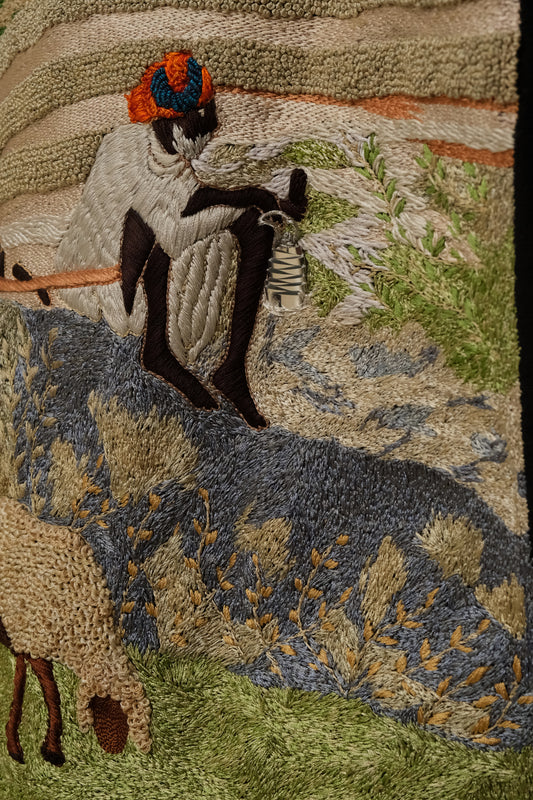 Sambhar 1.0 hand embroidered art shirt exploring pastoral landscapes through threadwork, shepherd imagery, grazing sheep motifs, and slow crafted textile storytelling shaped into a one of one wearable artwork