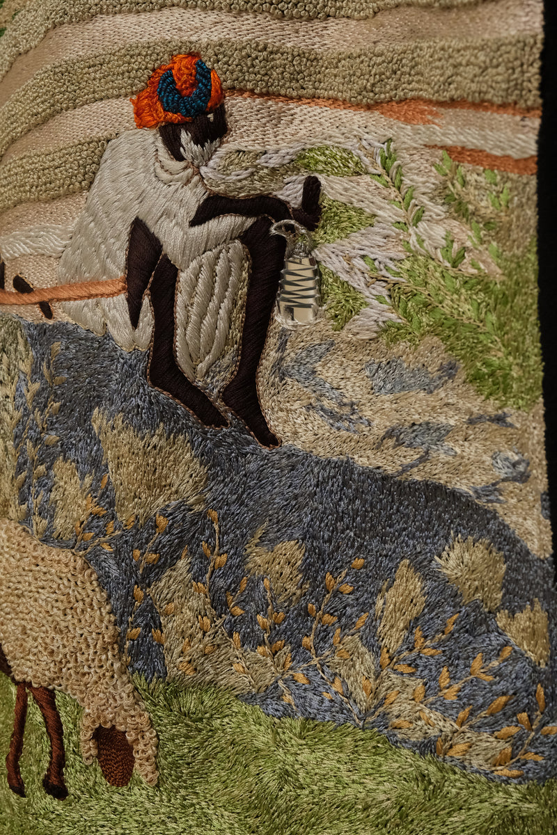 Sambhar 1.0 hand embroidered art shirt exploring pastoral landscapes through threadwork, shepherd imagery, grazing sheep motifs, and slow crafted textile storytelling shaped into a one of one wearable artwork