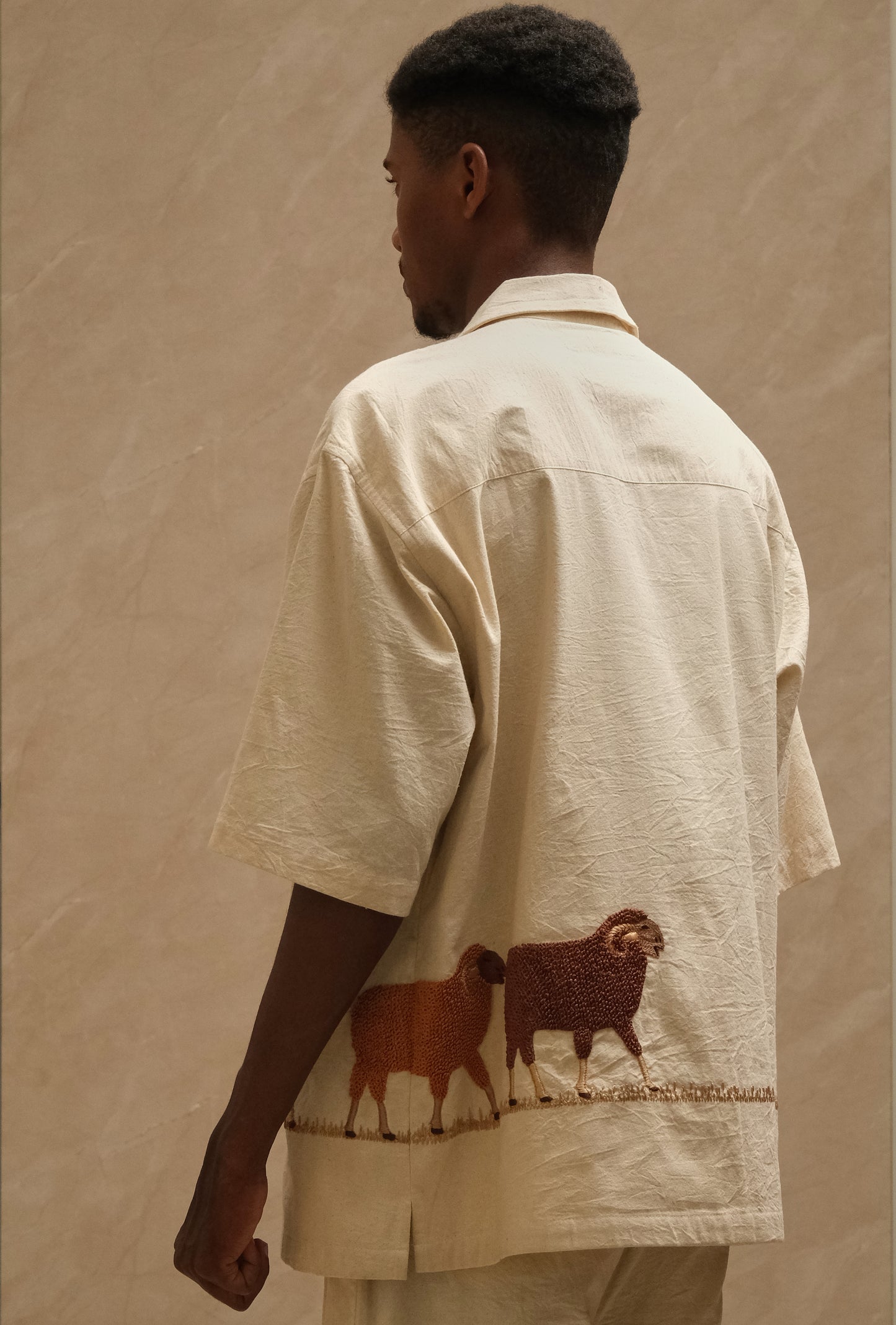 Hand embroidered Sambhar 2.0 collector shirt exploring rural landscapes through layered stitching, textured cotton fabric, silver ornamentation, and heritage inspired wearable textile craftsmanship