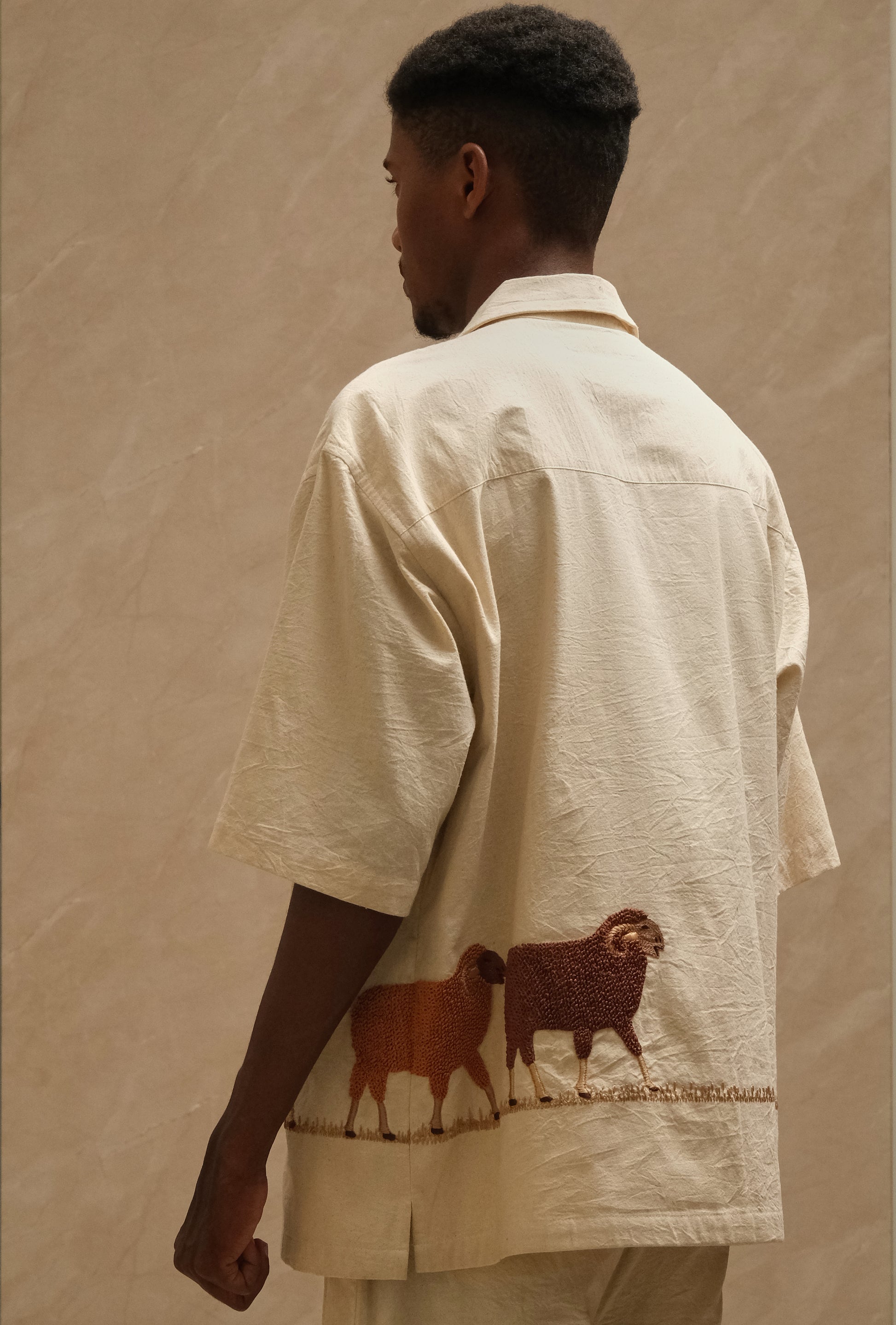 Hand embroidered Sambhar 2.0 collector shirt exploring rural landscapes through layered stitching, textured cotton fabric, silver ornamentation, and heritage inspired wearable textile craftsmanship